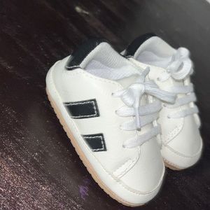 White and black baby shoes